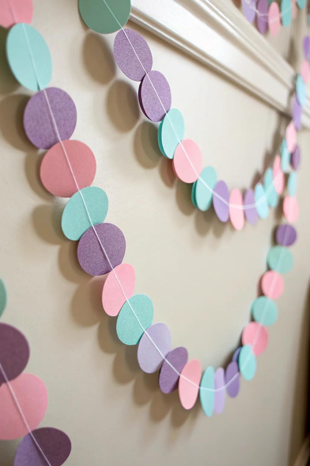 Brighten your space with a touch of whimsy: a handmade colorful paper garland that brings joy and simplicity to any room.