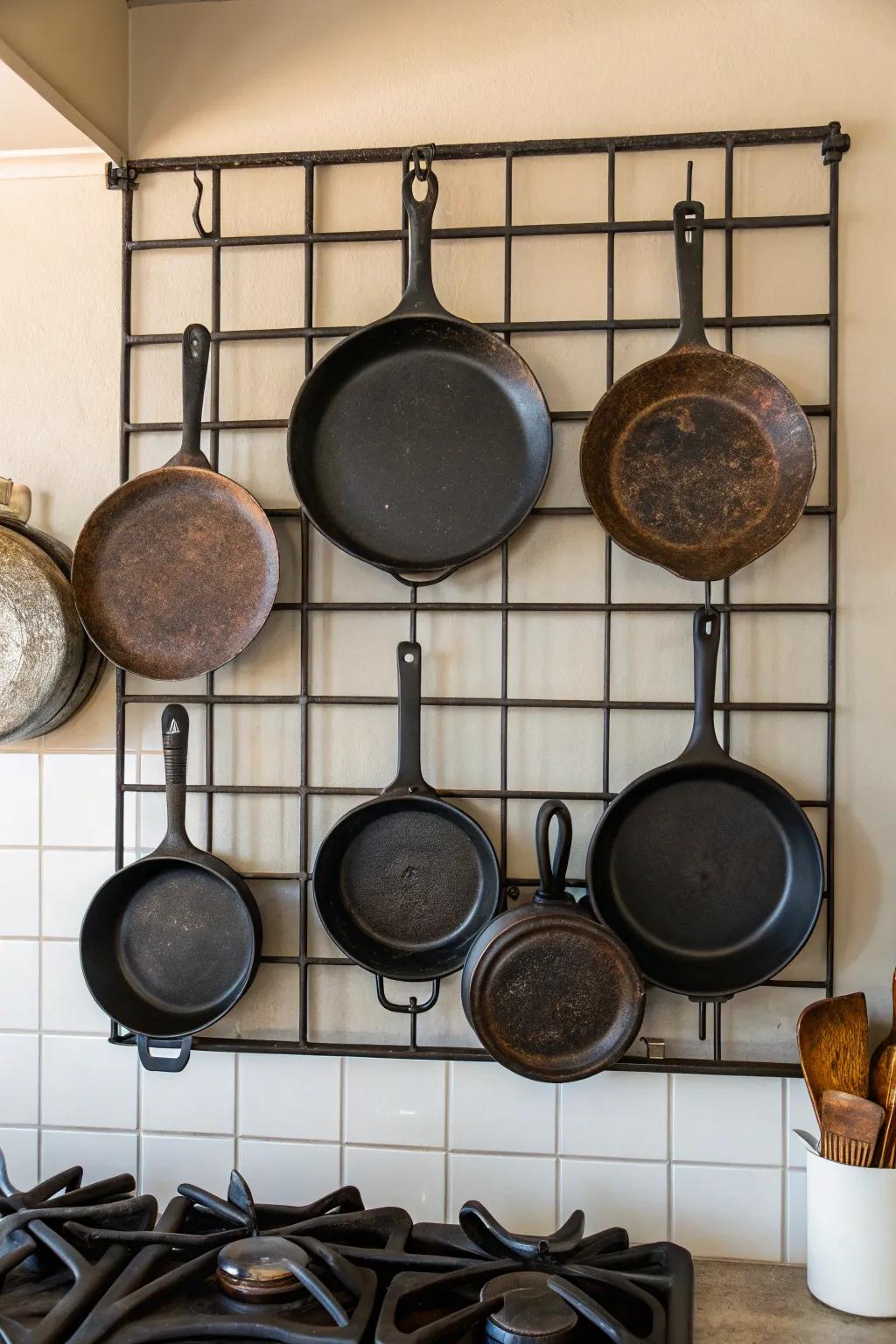 A stylish wall-mounted grid showcasing cast iron cookware.