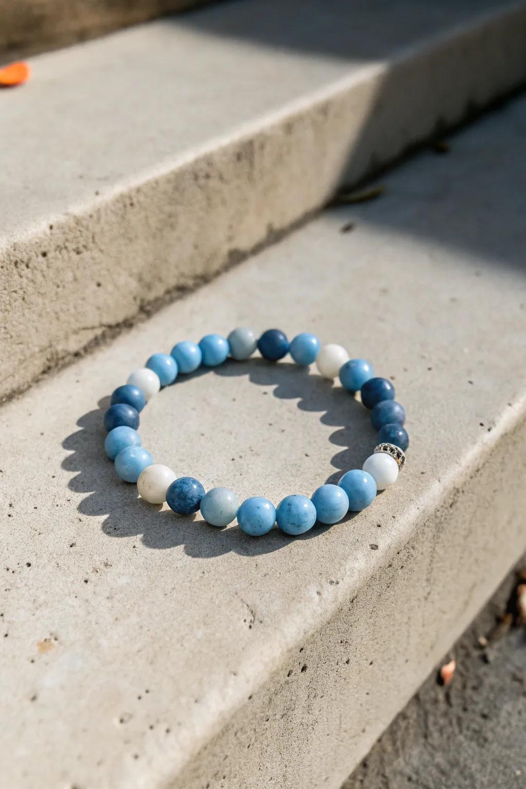 A monochrome blue clay bead bracelet offers a sleek and modern look.