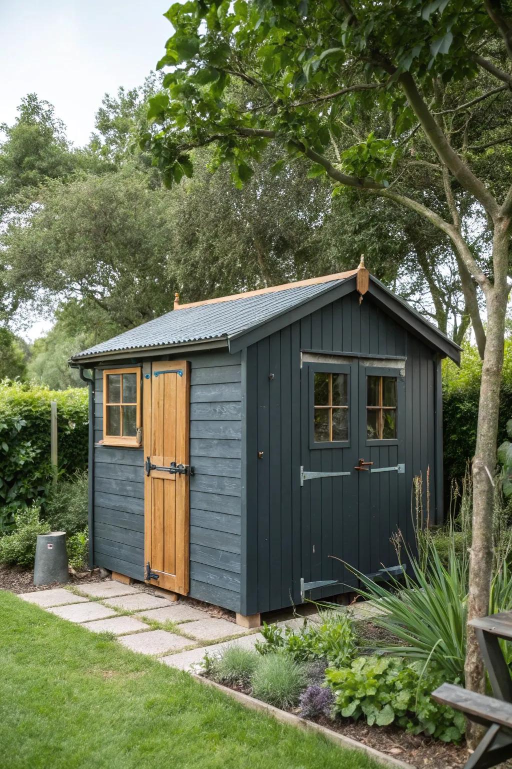 A charcoal grey shed that stands out amidst the garden foliage.