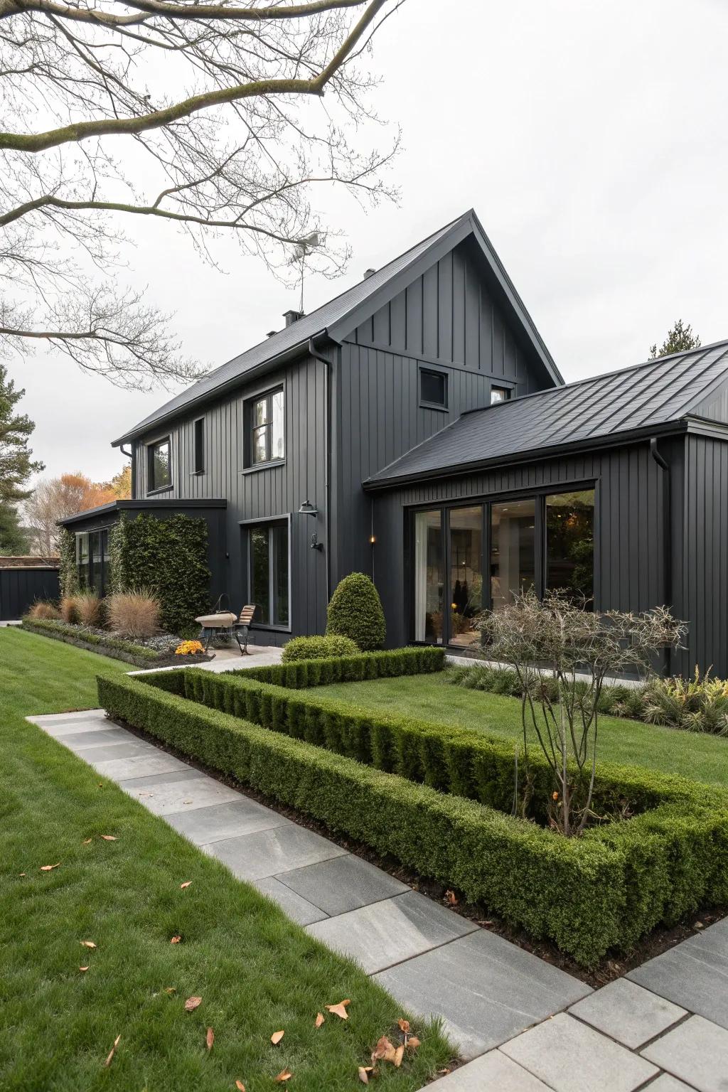 A modern house with a charcoal grey exterior and black trim, exemplifying minimalist elegance.