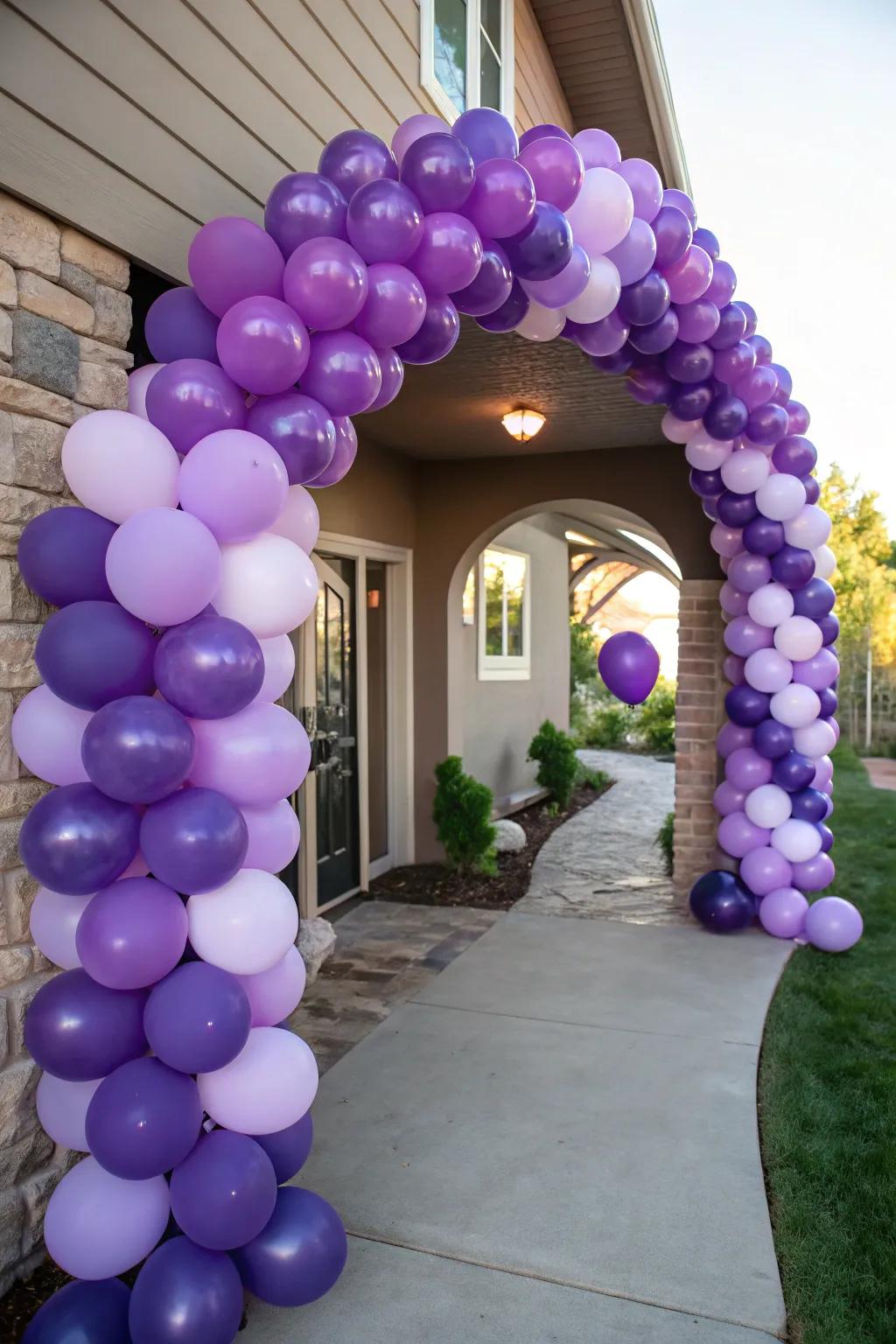 A majestic purple balloon arch to welcome guests in style.