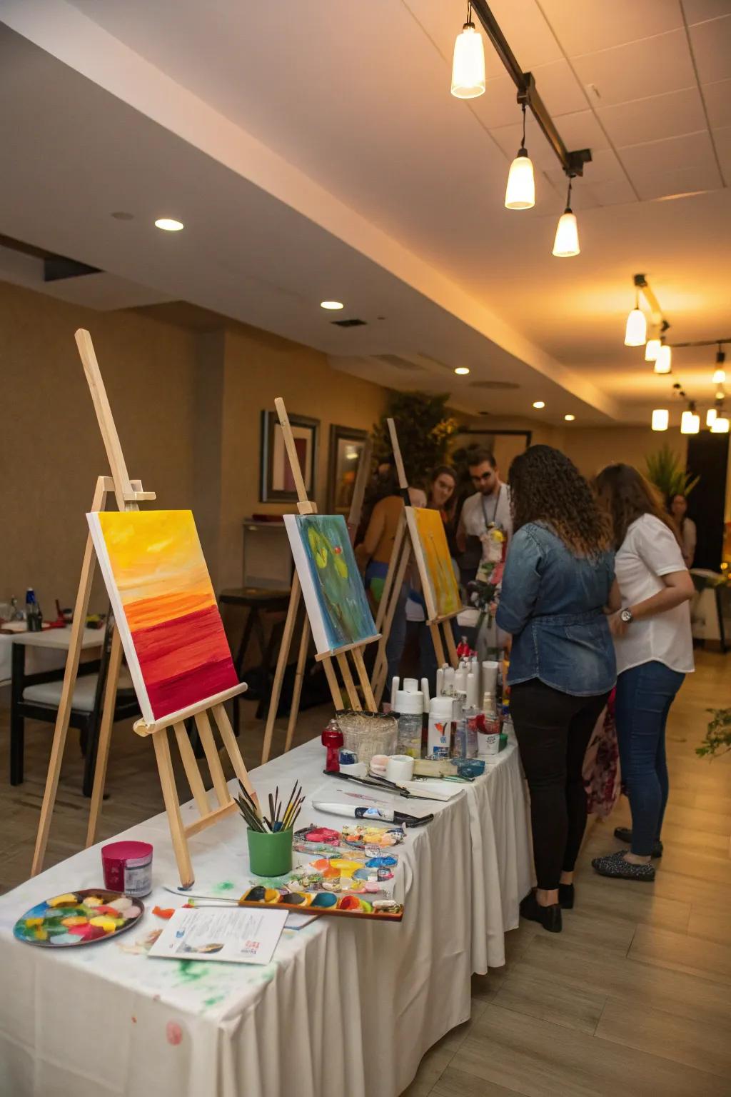 An art party setup with easels and paint supplies.