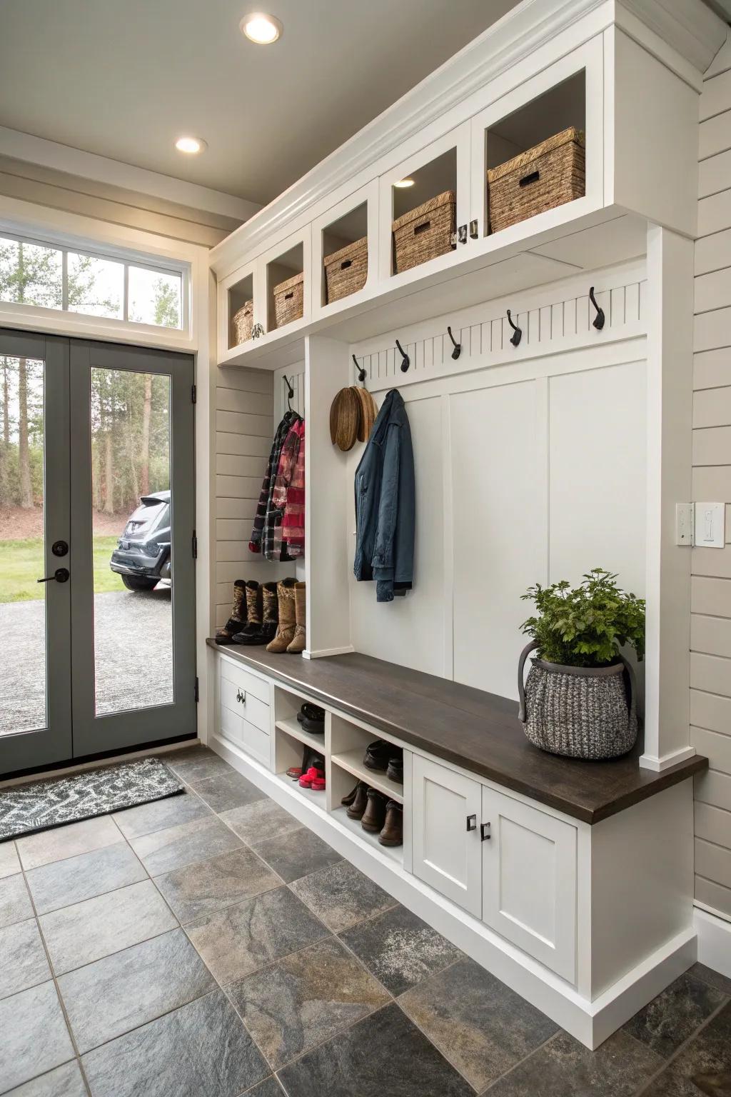 A bench with cubbies offers convenient storage in a garage mudroom.