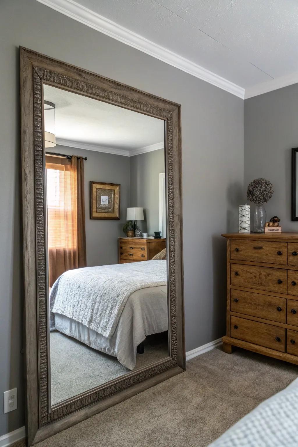 Mirrors enhance light and space in gray-walled bedrooms.