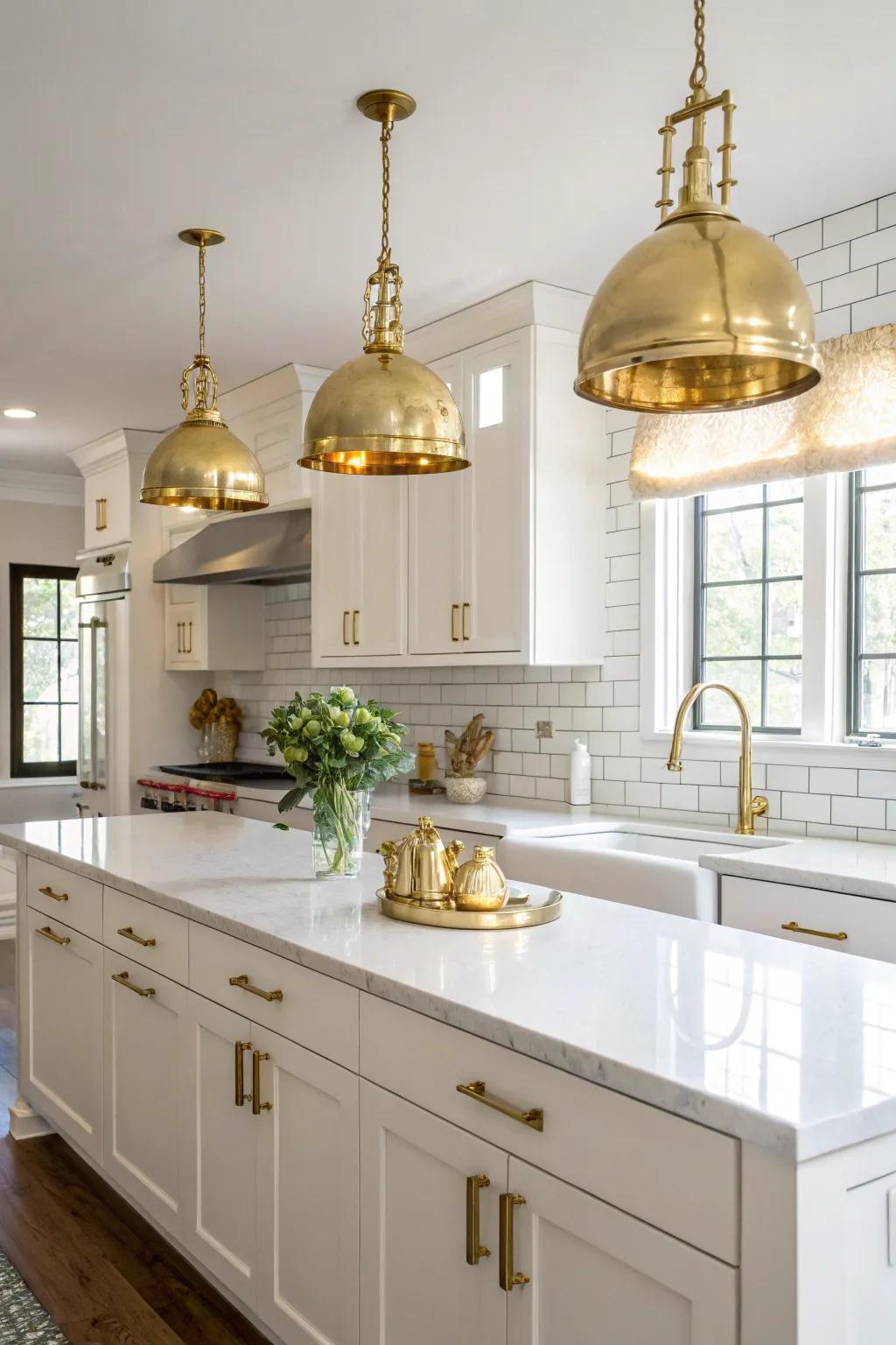 Gold hardware and matching lighting create a cohesive and elegant kitchen design.