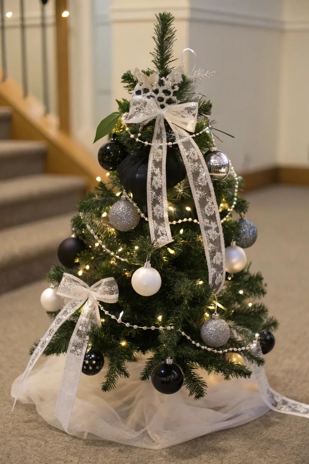 An elegant black and white mini Christmas tree.