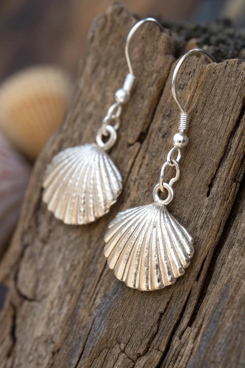 Elevate your Poseidon look with these handcrafted shell earrings, a subtle nod to the sea goddess with a touch of silver elegance.