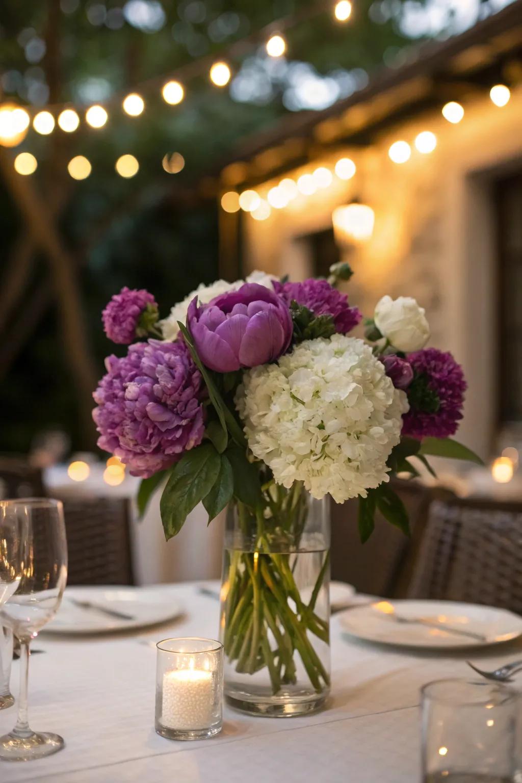 Purple peony and white hydrangea mix for a lush centerpiece.