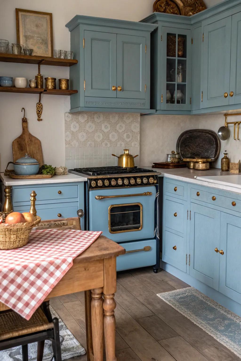 Blue cabinets with antique gold hardware bring warmth and vintage charm to the kitchen.