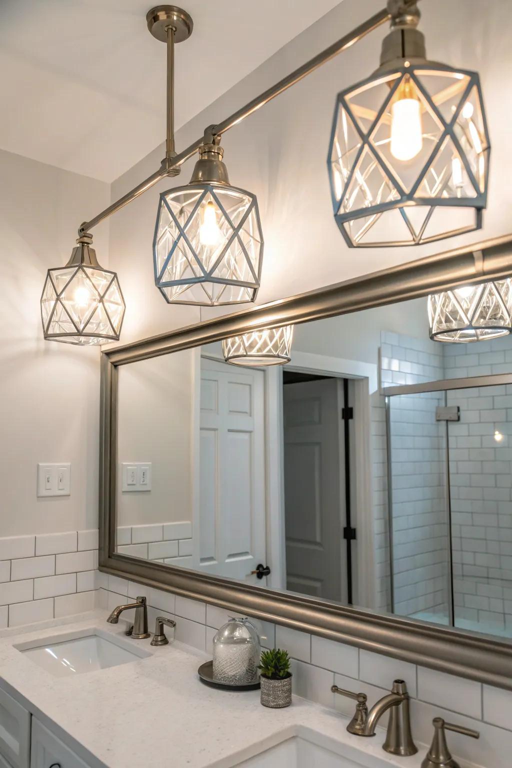 Bold geometric brushed nickel lighting above a bathroom mirror.