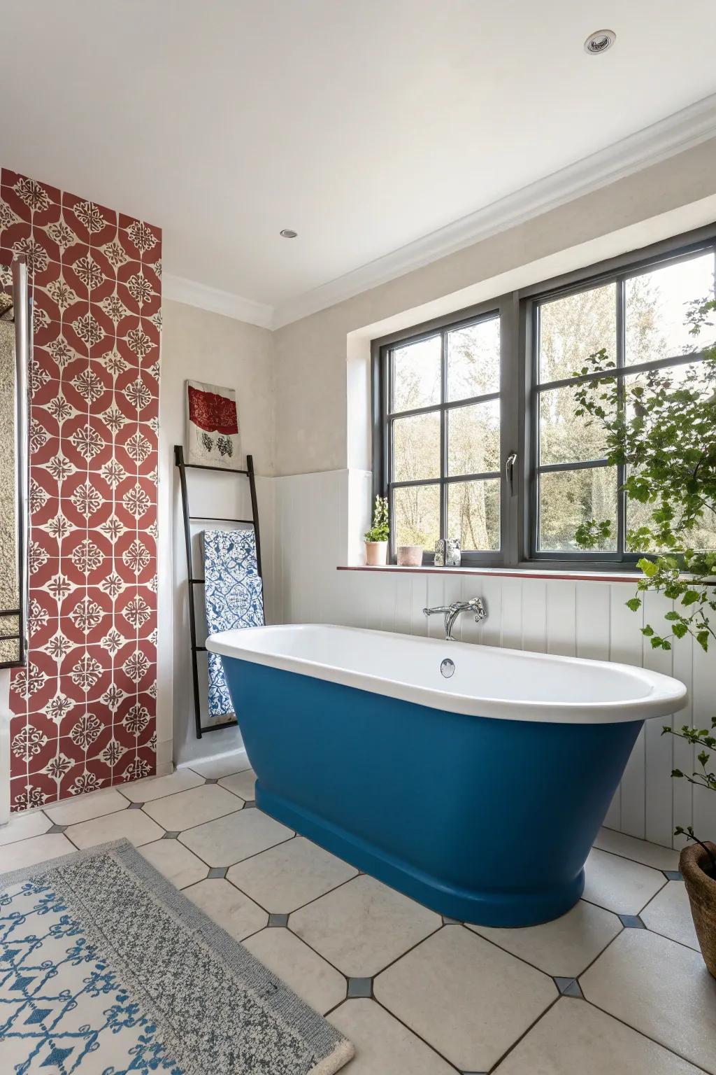 A feature wall enhances the prominence of a blue bathtub.