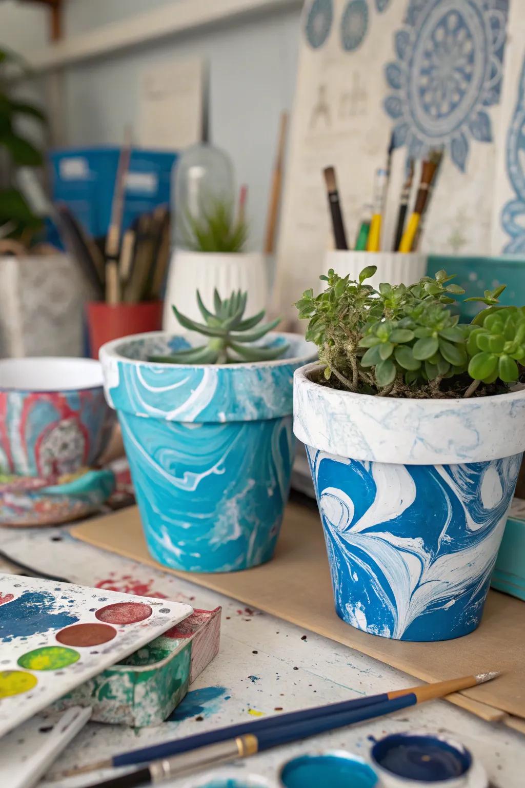 Poured paint planters offer a stunning marbled effect to showcase your creativity.