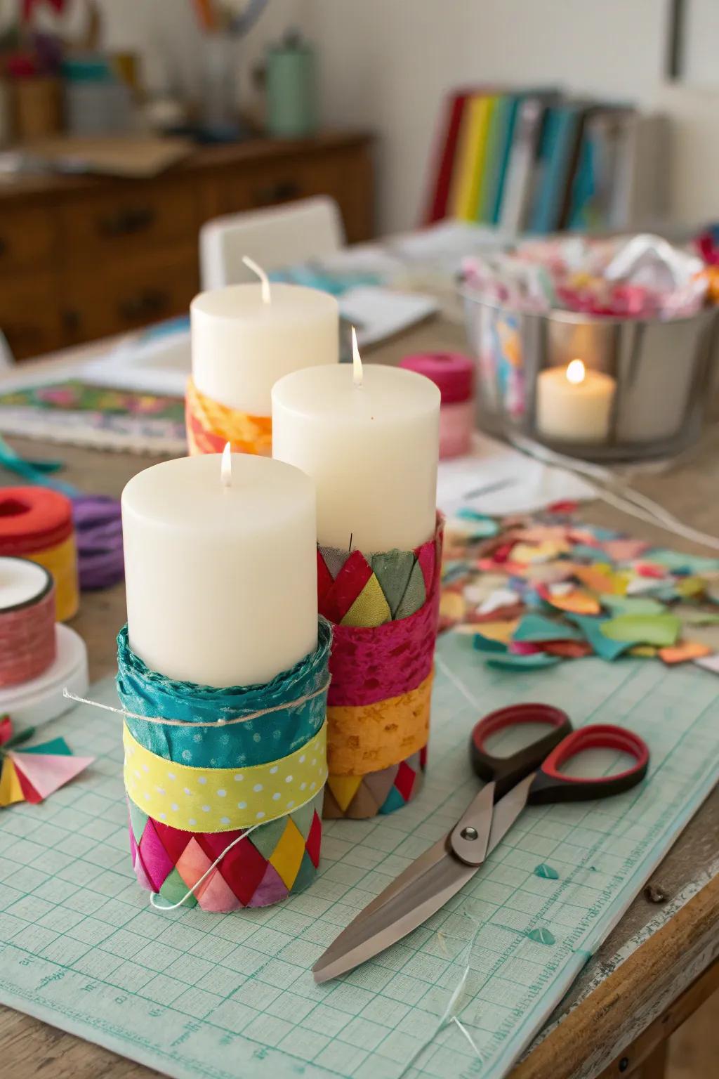 Vibrant candles decorated with fabric scraps for a whimsical touch.