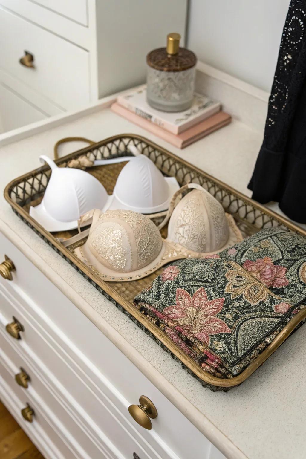 A decorative tray transforms bra storage into a stylish display.