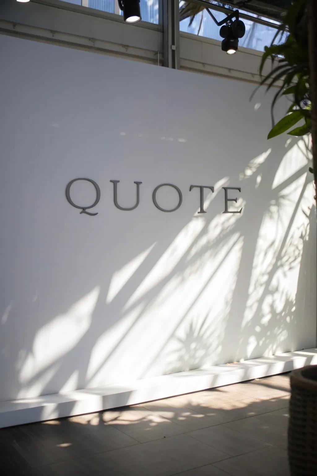 A quote with shadow effects giving it a three-dimensional appearance on a bright wall.