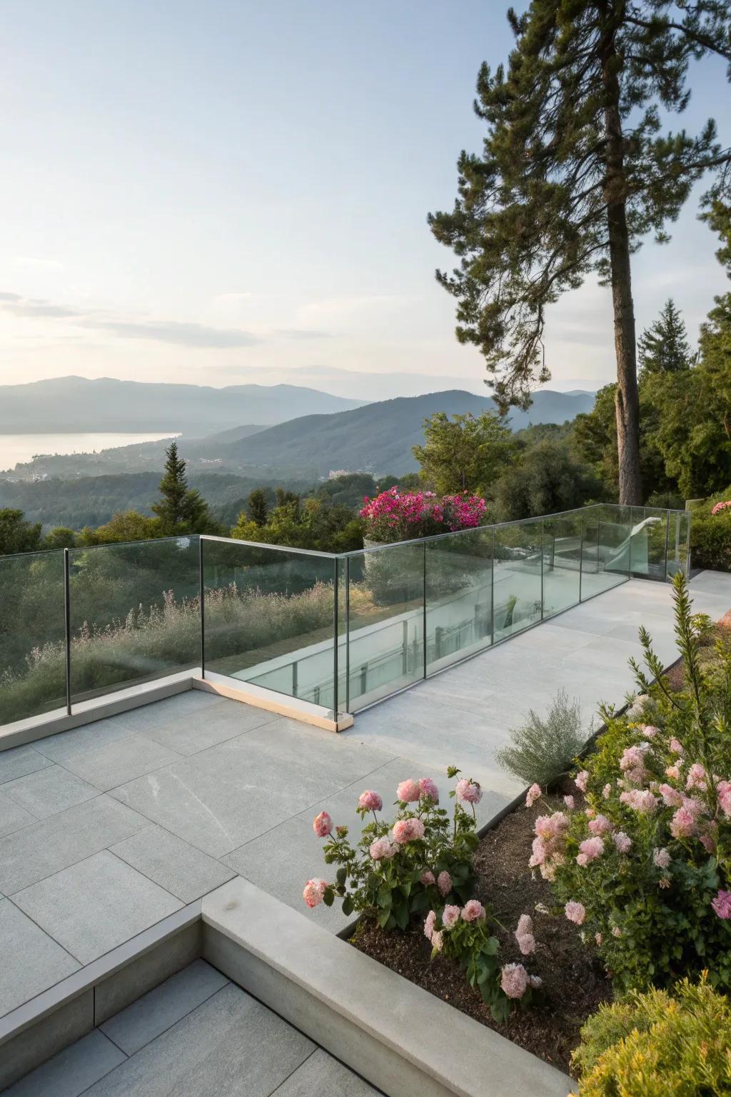 Glass railings add a modern touch to this raised concrete patio, enhancing the view.