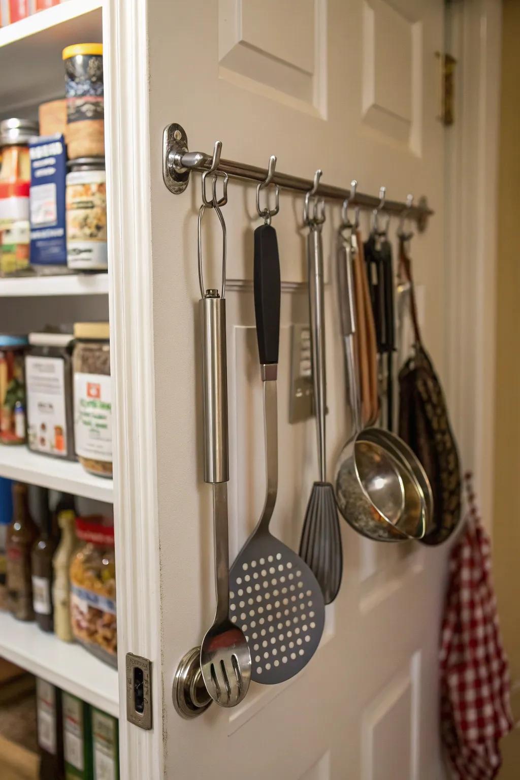 Over-the-door hooks save space in small kitchens.