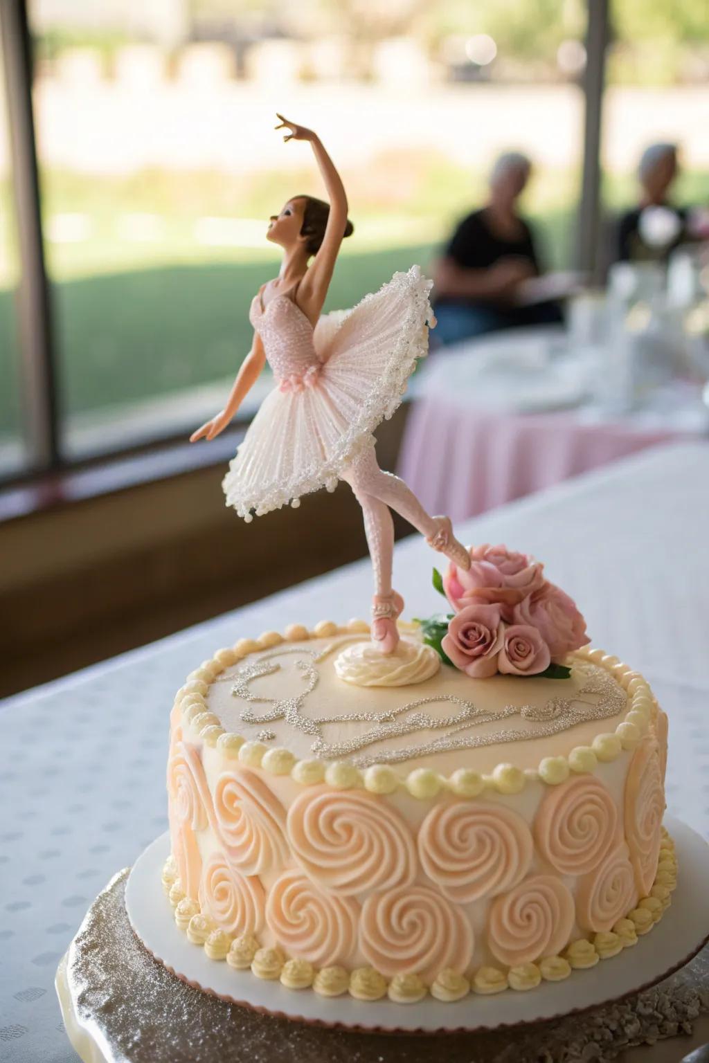 A cake with a 3D ballerina figurine as a topper.