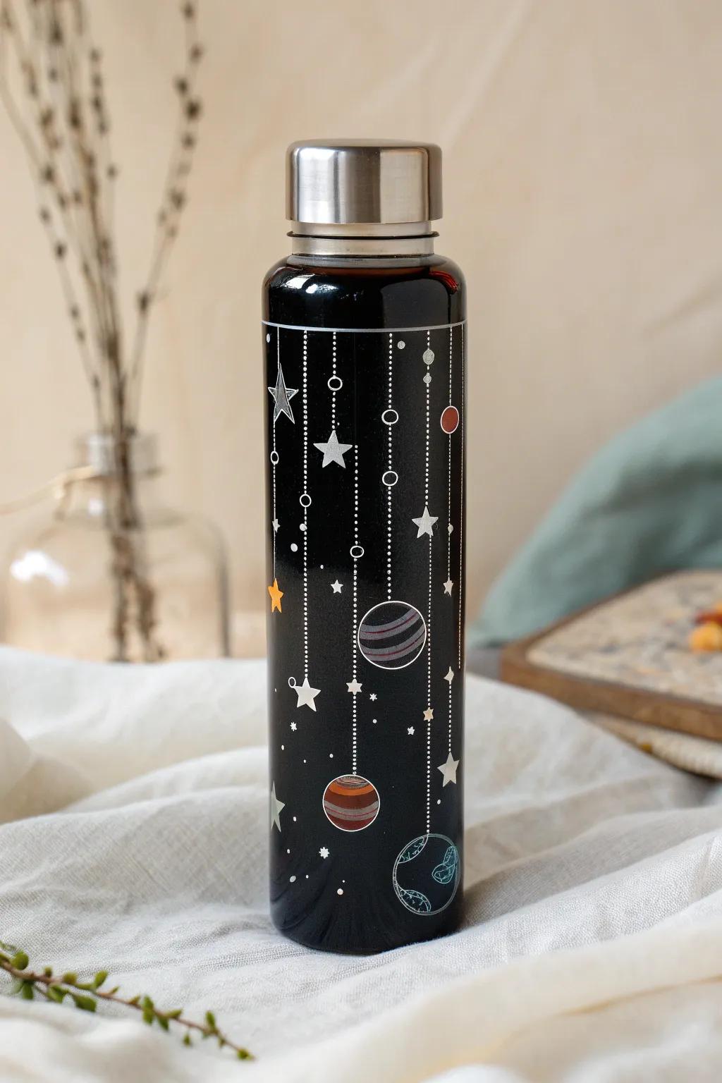 Embark on a cosmic journey with this Space Odyssey Sensory Bottle, a celestial delight for aspiring astronauts.