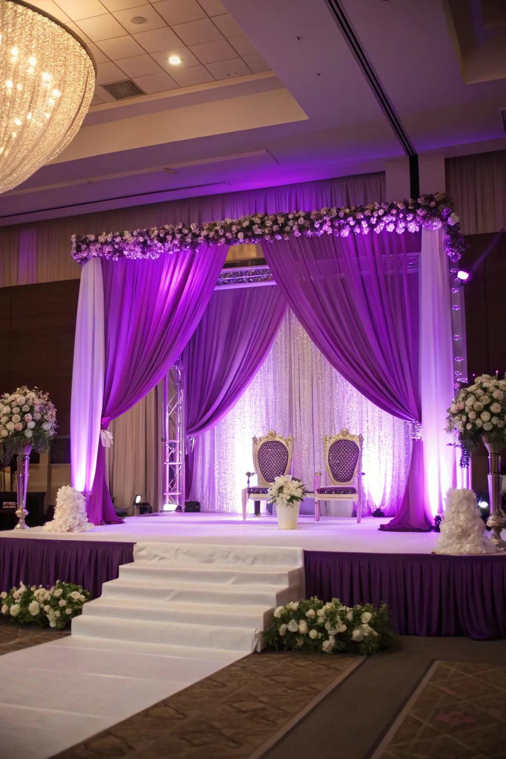 A dramatic backdrop with rich purple drapery.