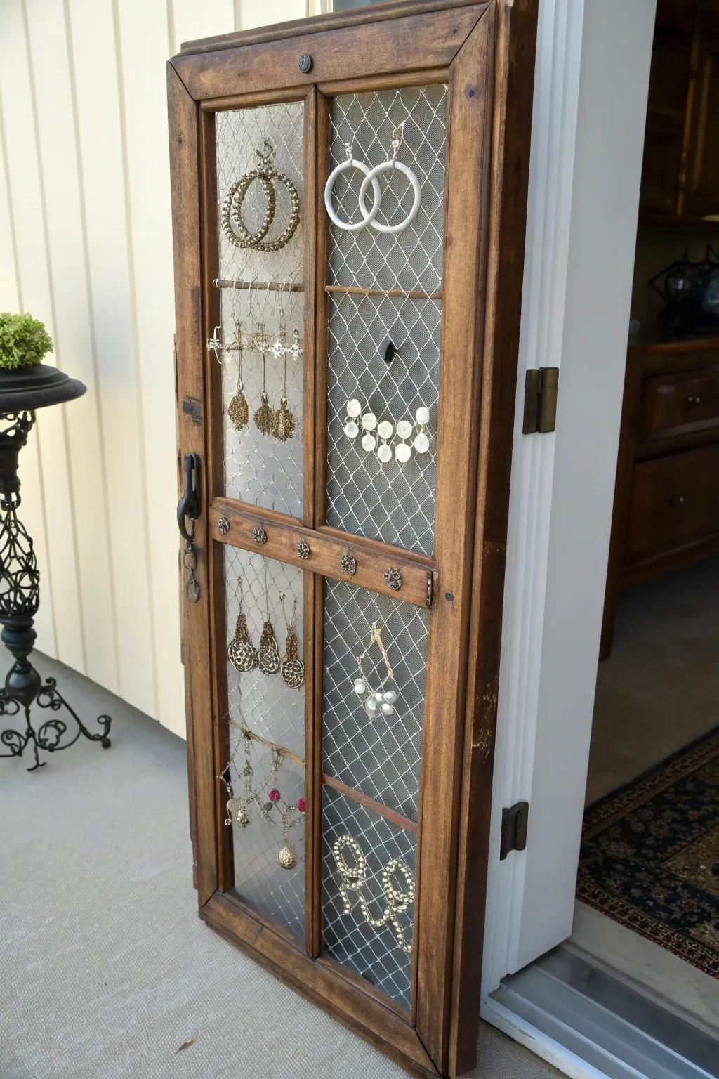 Transform elegance with purpose: A French door reimagined as a chic earring organizer.