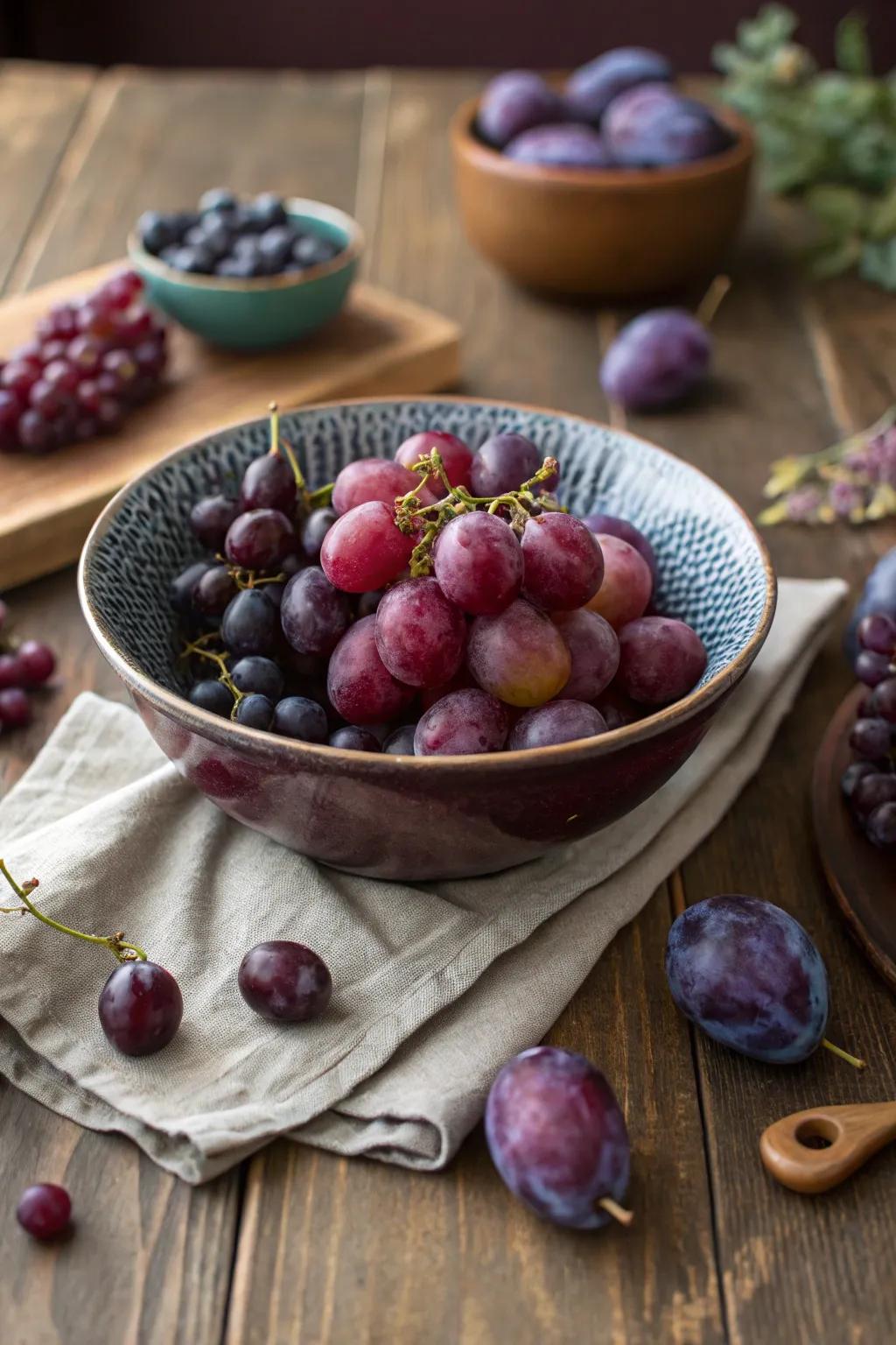 Purple fruits offer a fresh and functional centerpiece option.