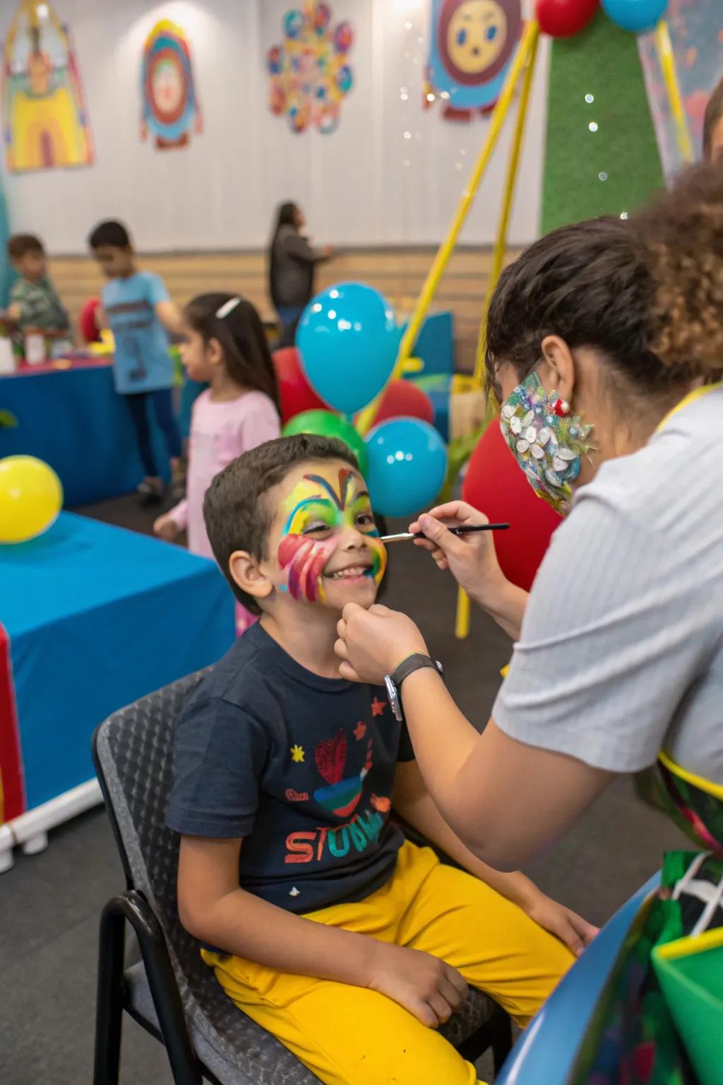 A child delighted with their colorful face paint, adding to the festive atmosphere of the party.