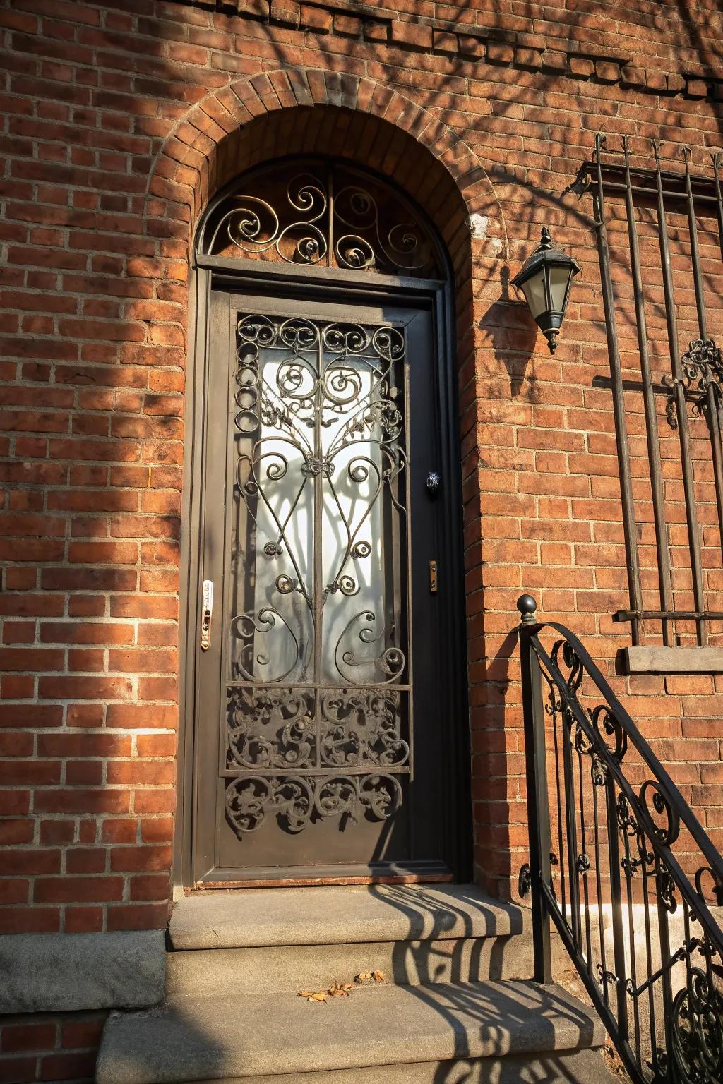 Decorative ironwork transforms doors into artistic statements.