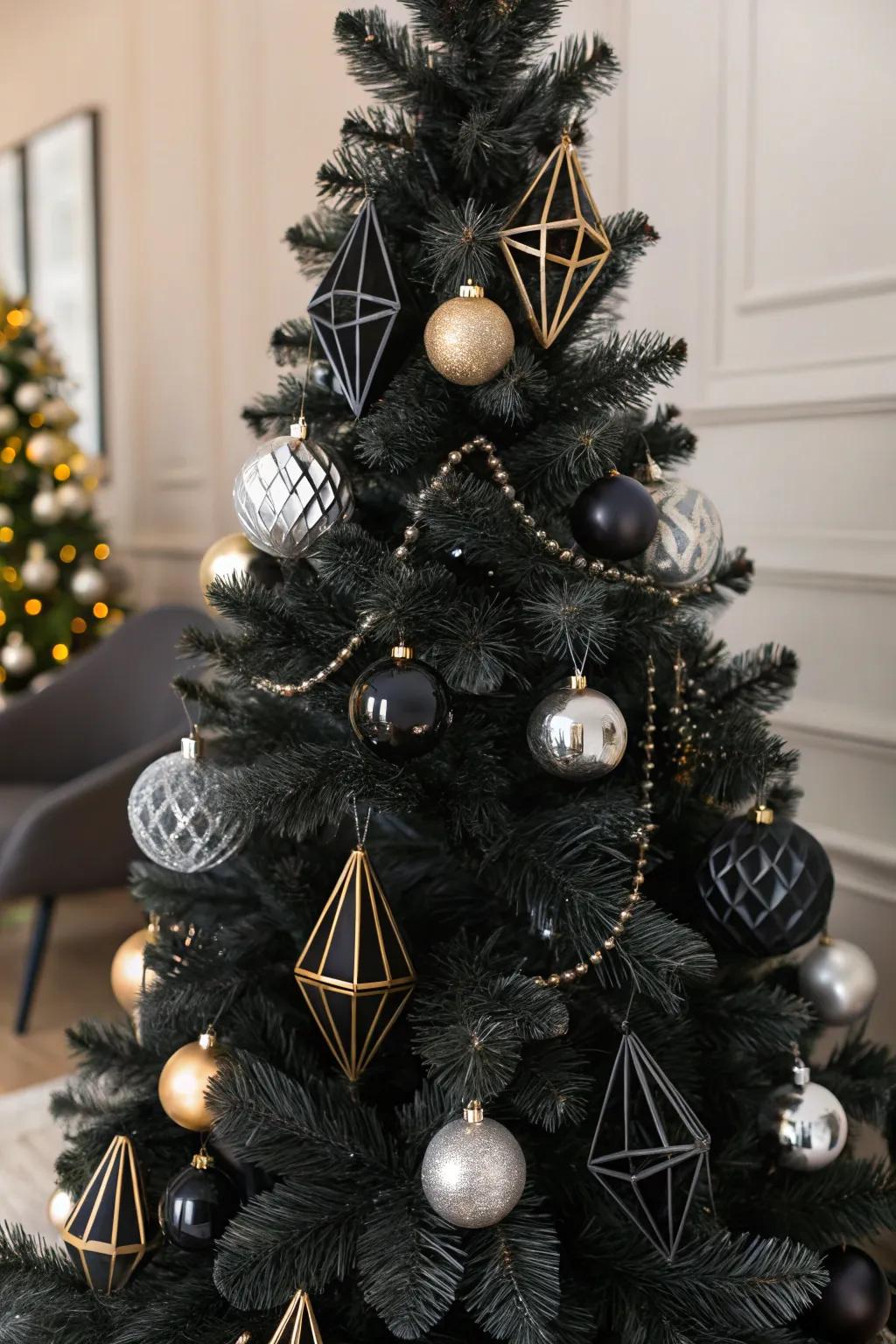 An Art Deco-inspired black Christmas tree with glamorous black and gold accents.