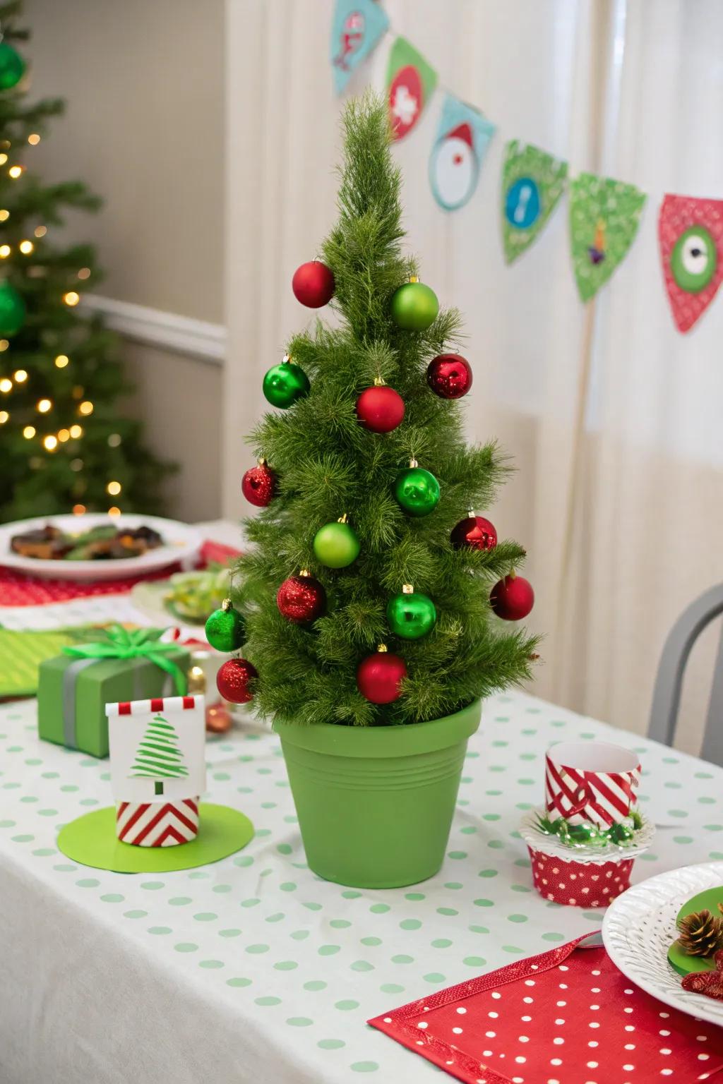 A mini Grinch-themed tree adding a whimsical touch to the festive table.