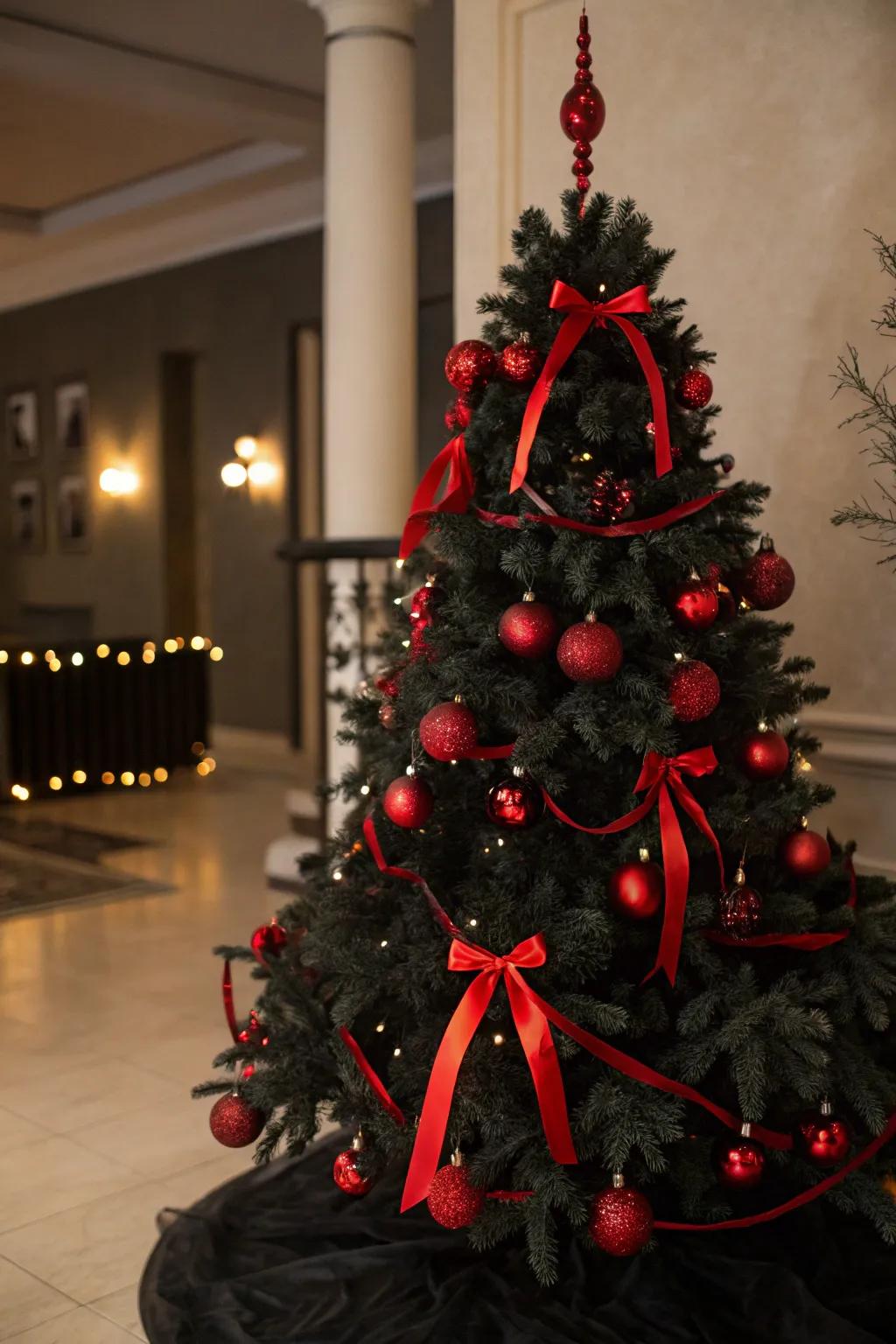 A classic black Christmas tree with bold red accents for a festive touch.