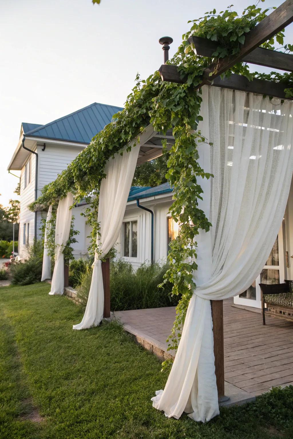 A pergola adorned with curtains, creating a private and elegant space.