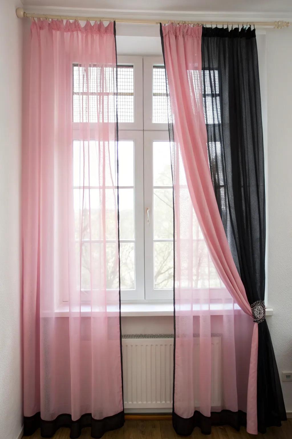 Elegant pink and black window treatments for light control.