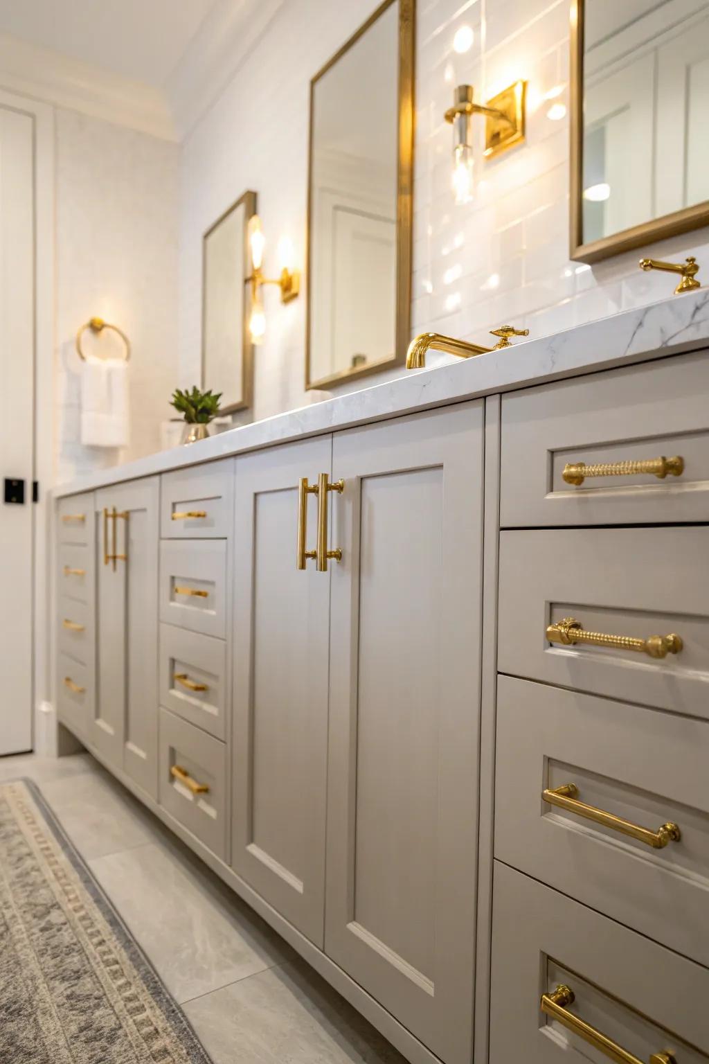 Custom brushed brass hardware on cabinets for a tailored bathroom design.