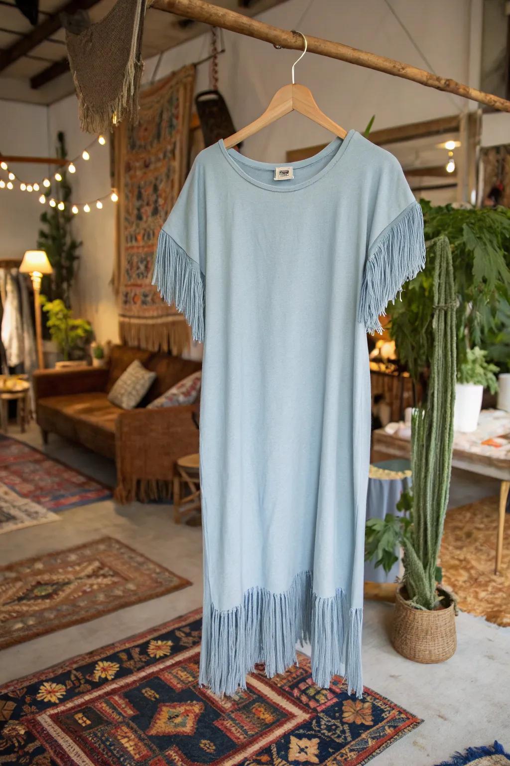 A boho-inspired t-shirt dress with fun fringe sleeves.