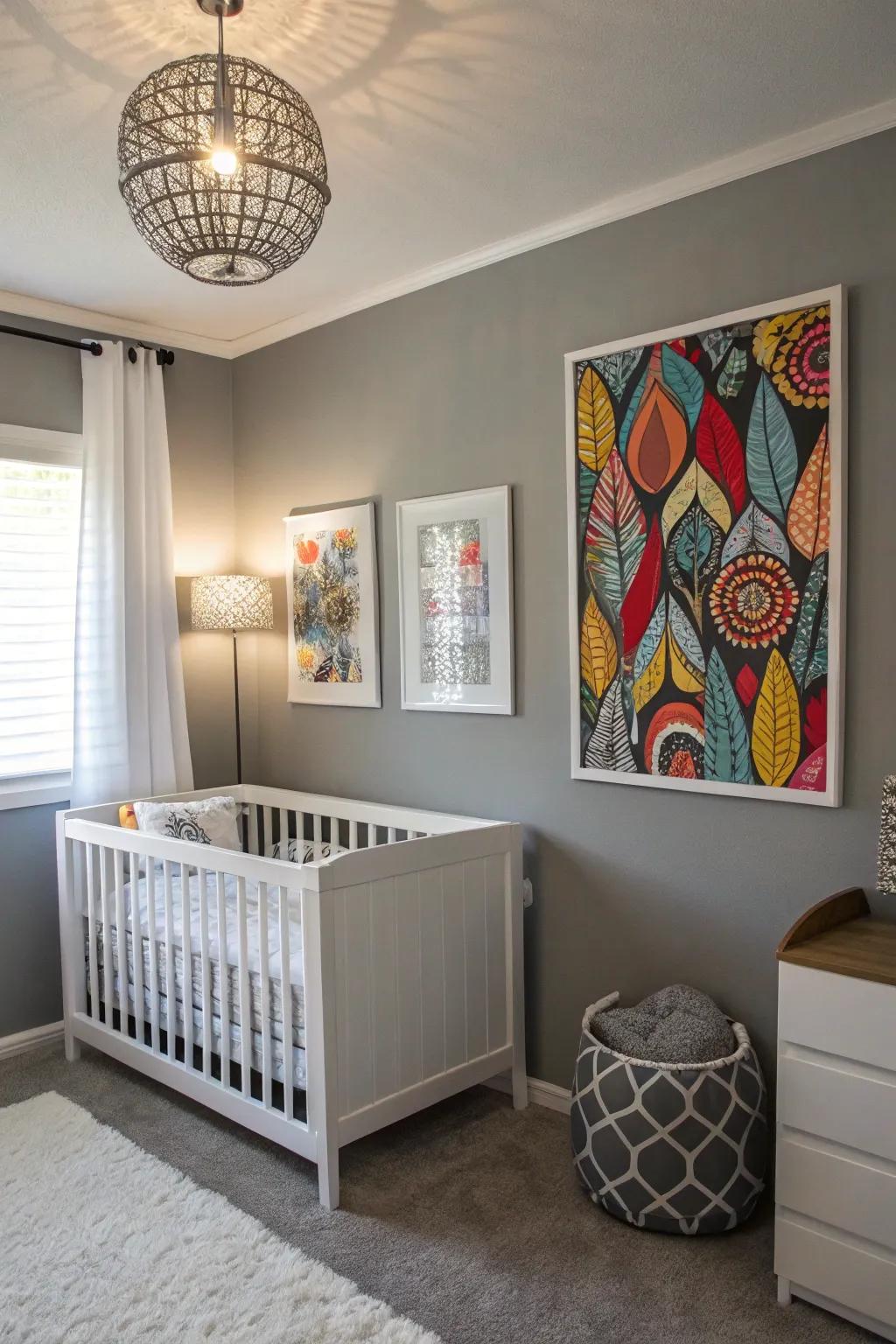 Bold art pieces bring personality to a grey nursery.