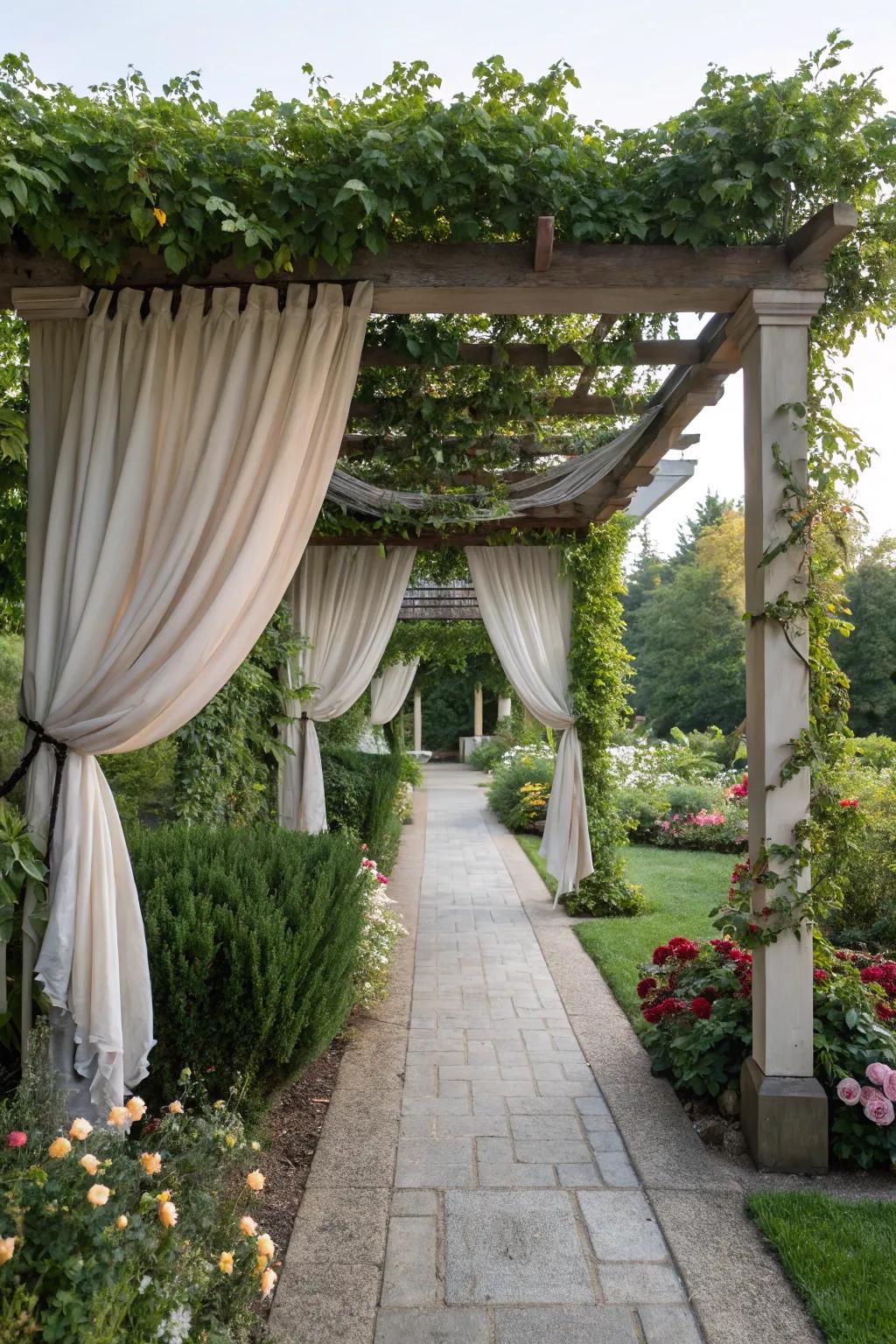 A pergola with drapes creates a cozy and protective entrance.