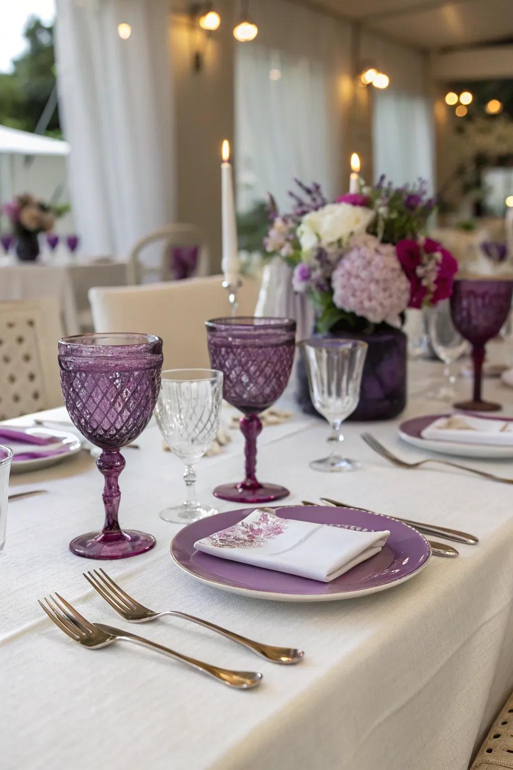 Elegant table settings with purple-rimmed glassware.