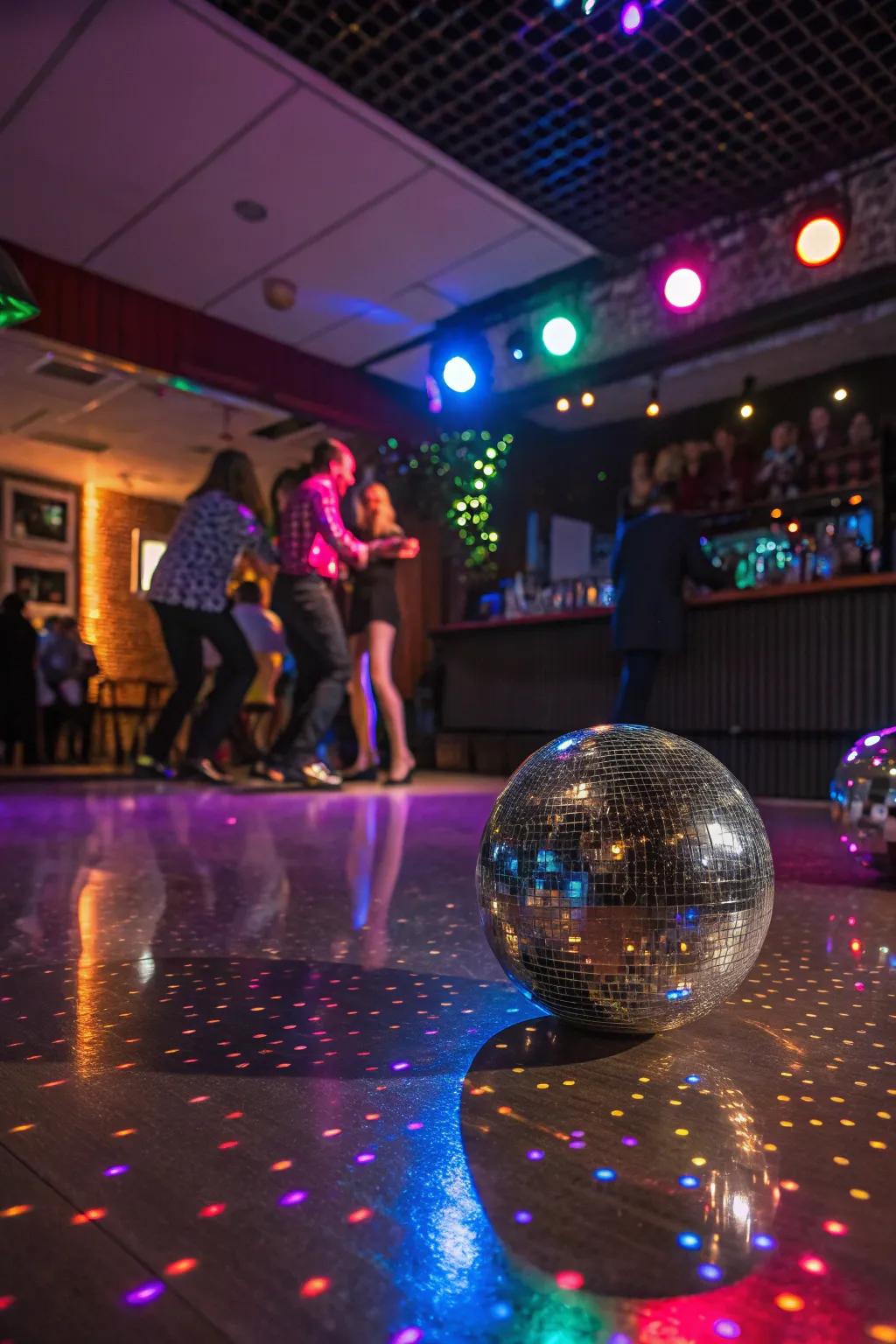 Disco balls bring sparkle and a retro vibe to the celebration.