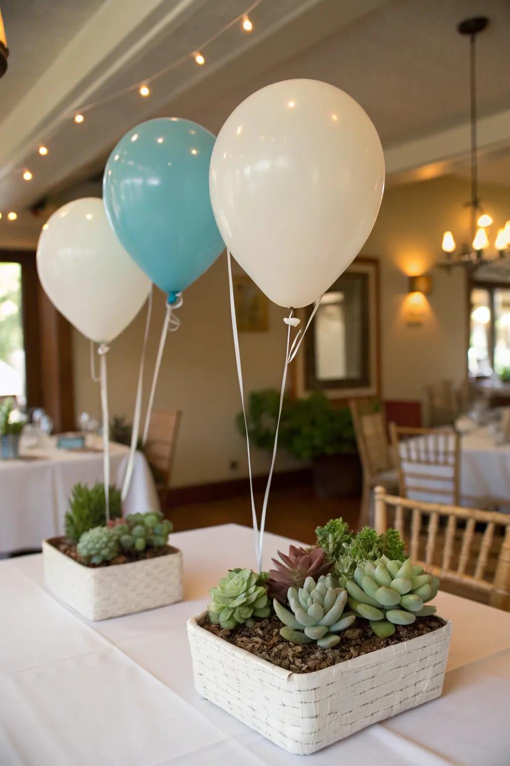 Lively succulent planters adding greenery as practical balloon weights.