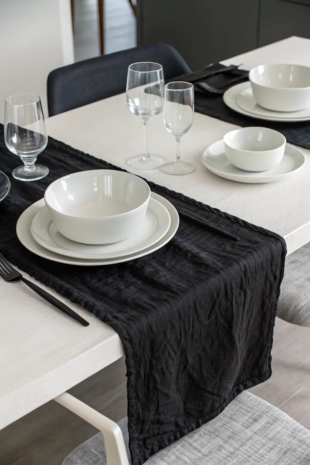 Modern monochrome with a black cheesecloth runner.