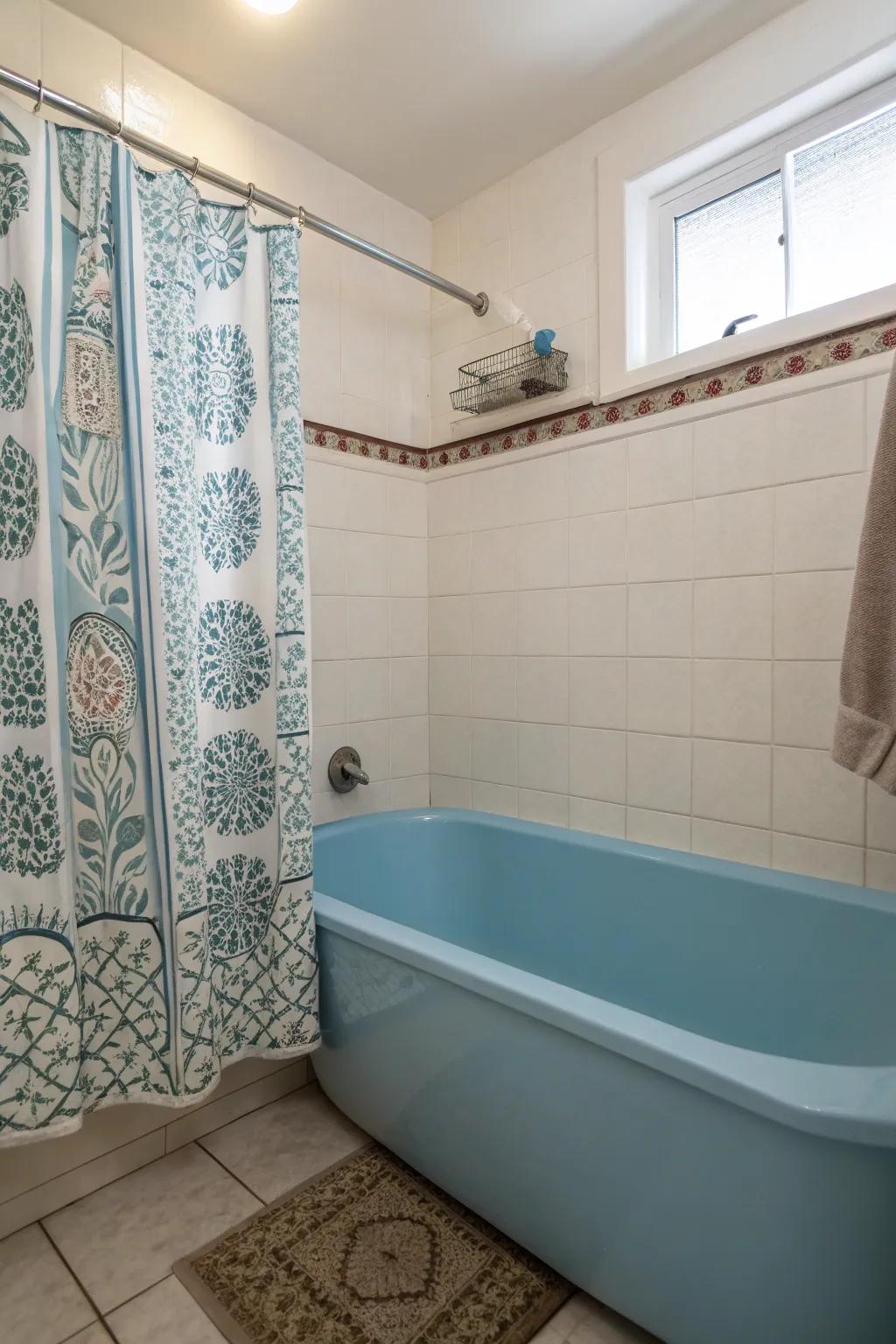 Subtle patterns add playfulness to the serene setting of a blue bathtub.