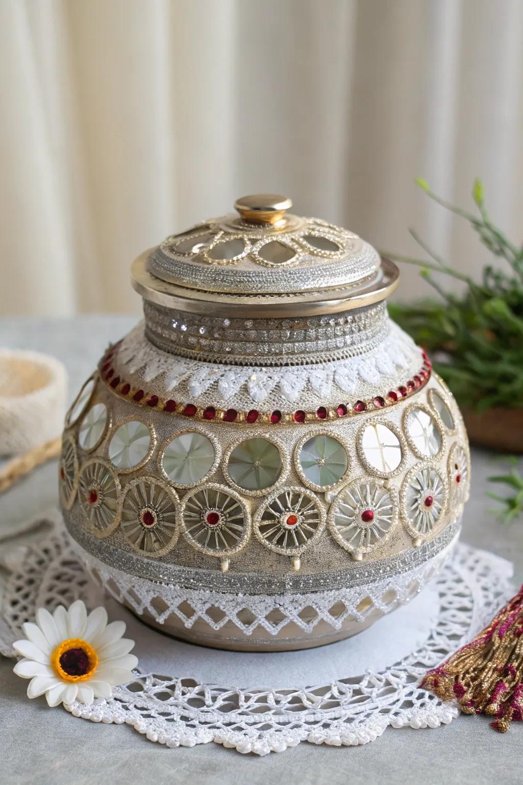 A decorative Garba Matli pot embellished with mirrors and lace for Navratri.