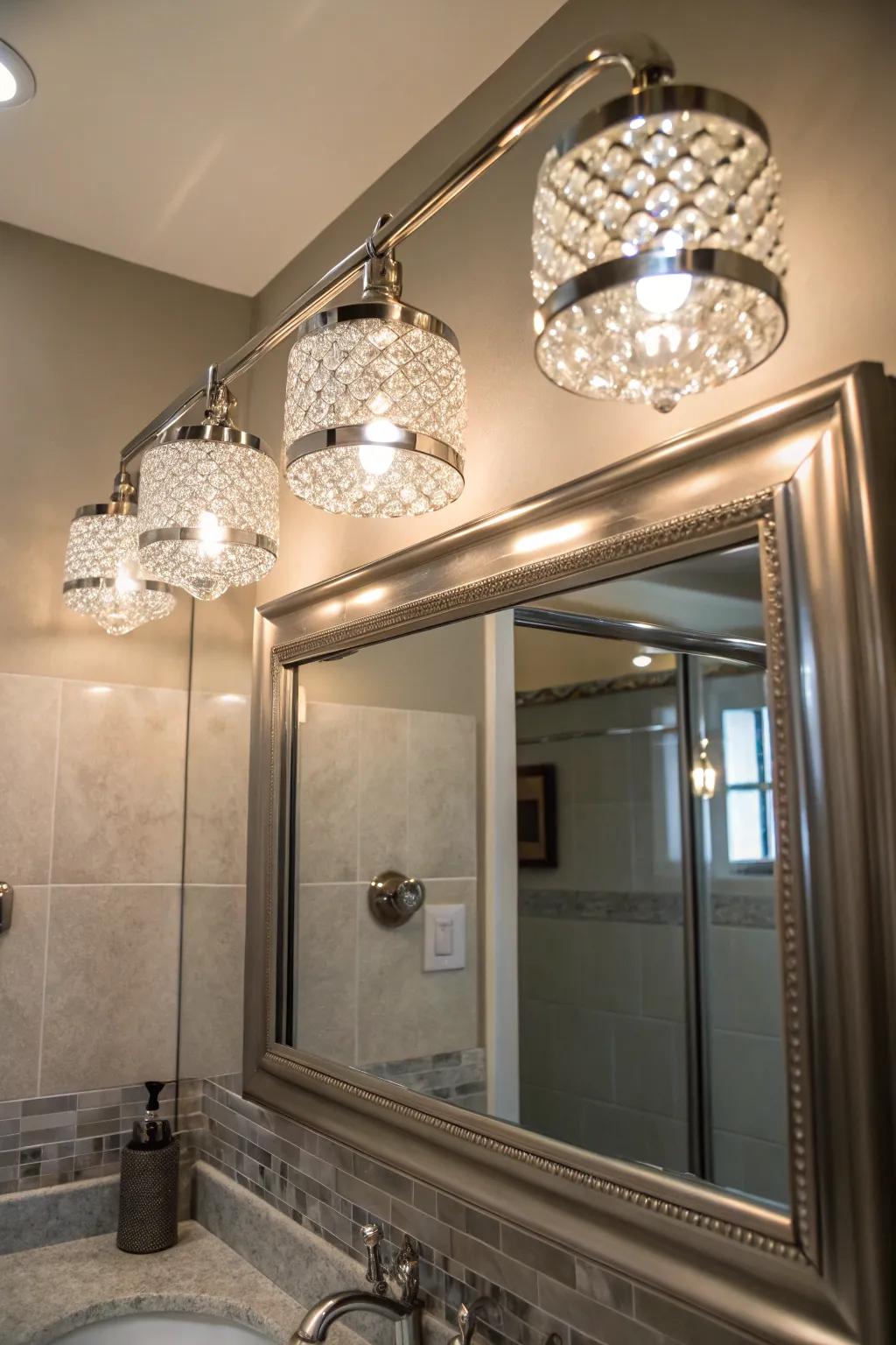 Luxury touch with crystal accented brushed nickel lighting above a bathroom mirror.