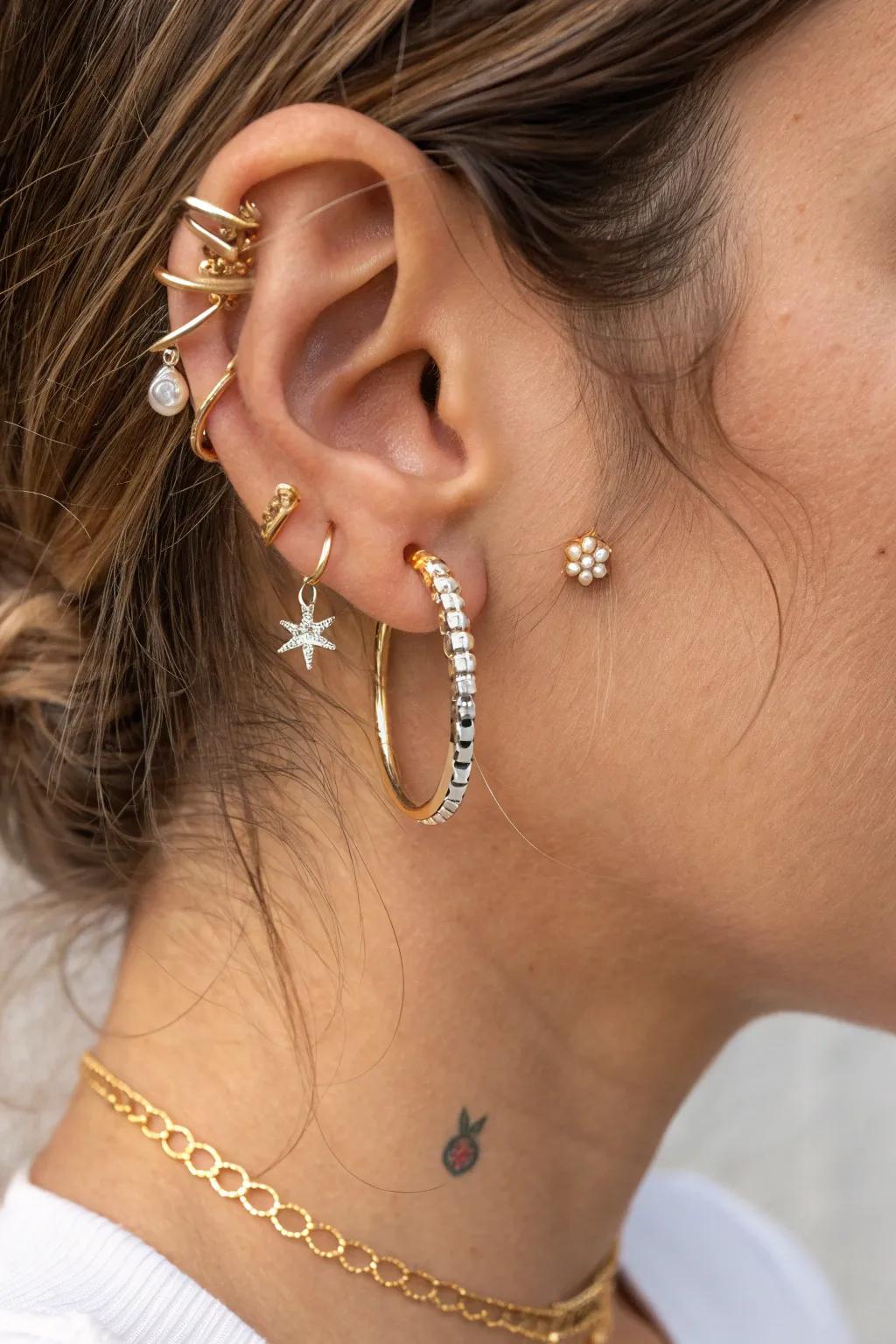 Elevate your ear game by playing with proportions—mix tiny studs with bold hoops for a chic boho-minimalist look!