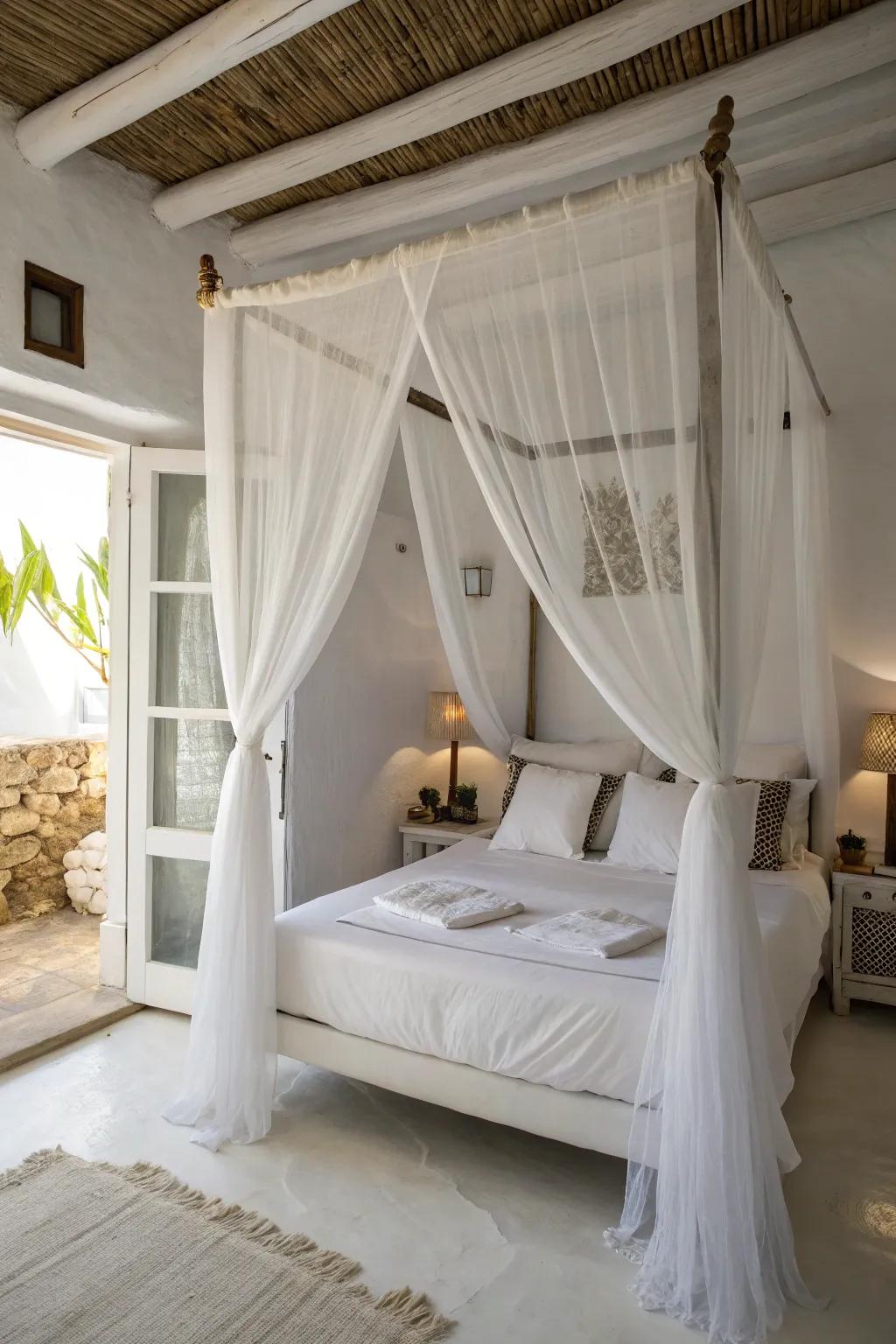 A canopy bed adds drama and elegance to a small white bedroom.