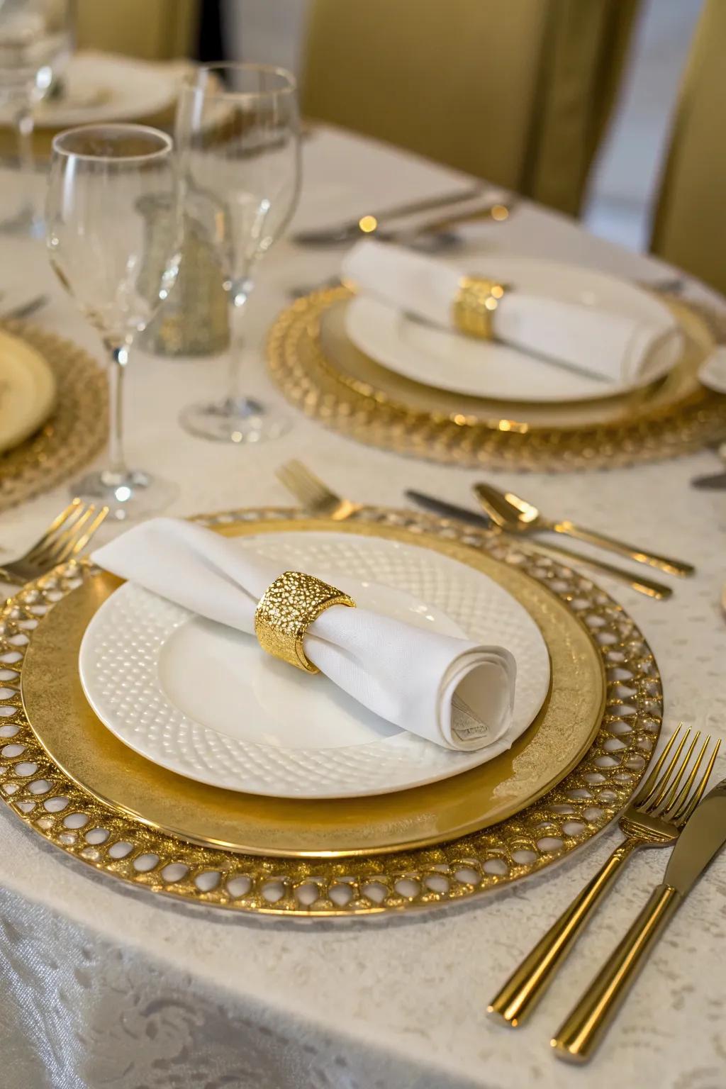 Elegant gold and white table settings perfect for a 50th anniversary dinner.