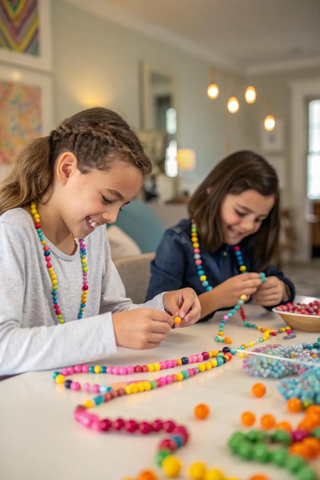 Young party guests engaged in making beaded jewelry, surrounded by a rainbow of bead options.