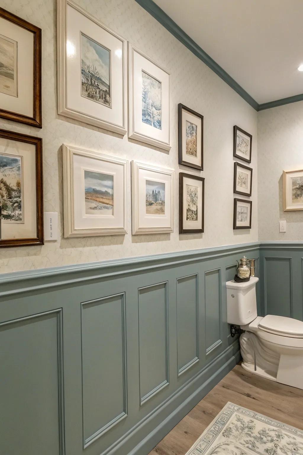 Elegant bathroom with picture molding framing artwork.